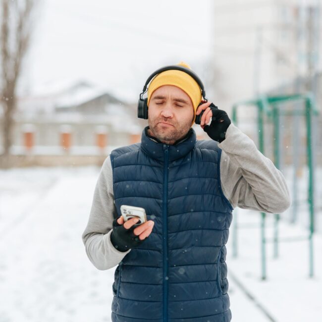 man with headphones and a phone