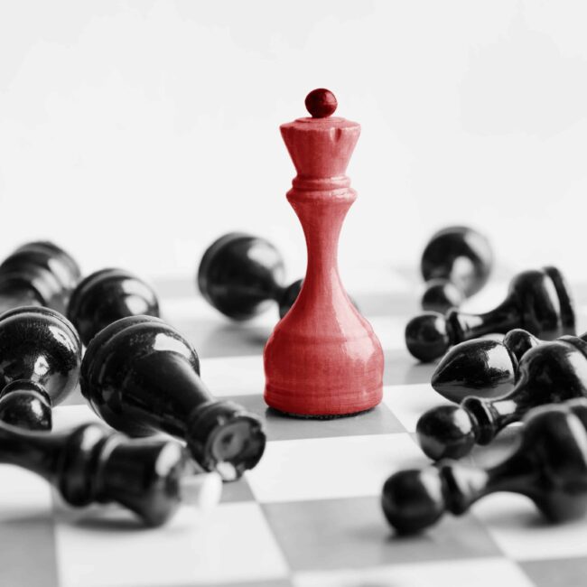 white-chess-queen-beats-blacks-on-chessboard