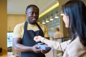girl paying with her smartwatch