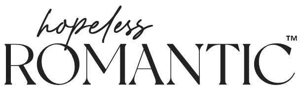 Black and white “hopeless ROMANTIC™” logo with cursive and bold fonts symbolizing emotional contrast.